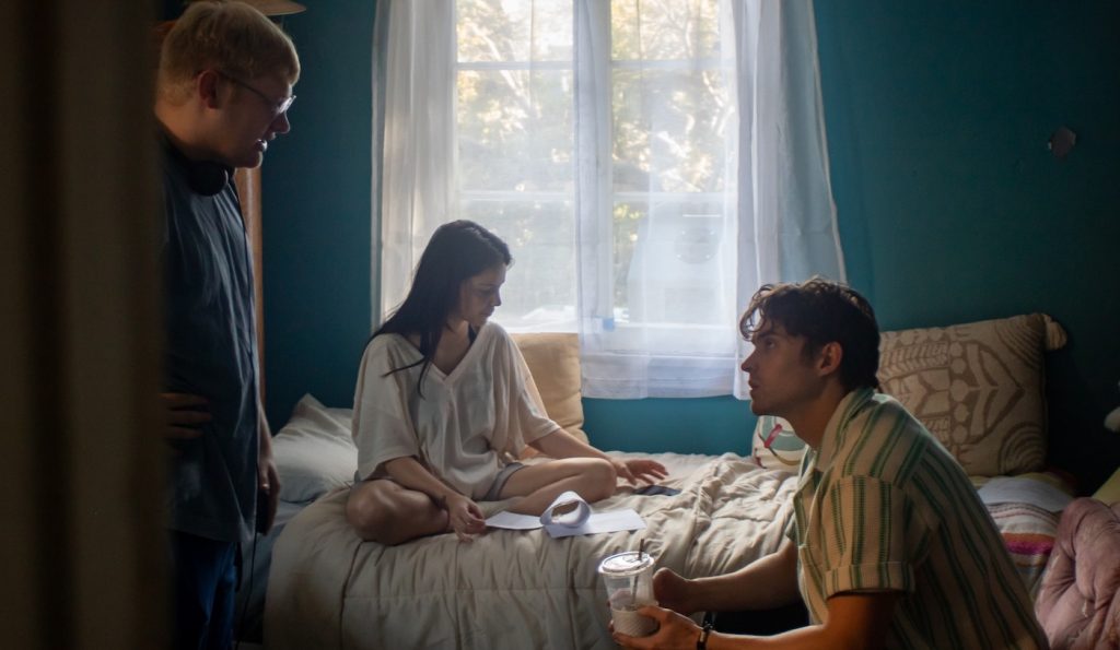 Curry Barker working with actors on the set of Obsession